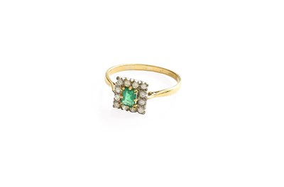 Lot 427 - An Emerald and Diamond Cluster Ring, the...