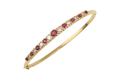Lot 2039 - An 18 Carat Gold Ruby and Diamond Hinged...