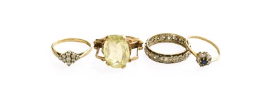 Lot 445 - Four 9 Carat Gold Rings, including a green...