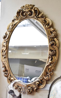 Lot 1206 - A Reproduction Gilt and Gesso Mirror, the oval...