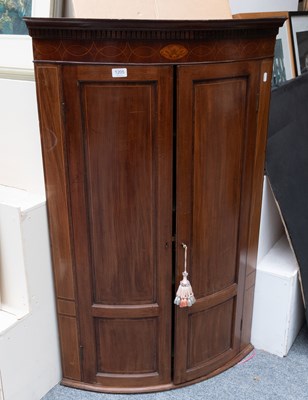 Lot 1205 - A George III Inlaid Mahogany Bow Front Hanging...