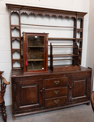 Lot 1283 - A George III Oak Dresser and Rack, the base...