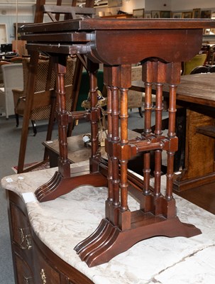 Lot 1317 - A Reproduction Nest of Mahogany Tables on...