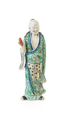 Lot 46 - A Chinese Porcelain Figure of an Immortal,...