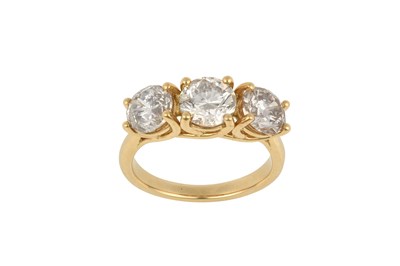 Lot 2311 - A Diamond Three Stone Ring the round brilliant...