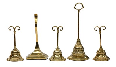 Lot 682 - A Set of Three Brass and Cast Iron Doorstops,...