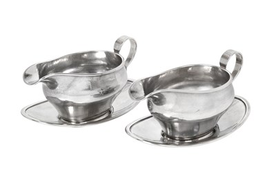 Lot 2572 - A Pair of George VI Silver Sauceboats and Stands