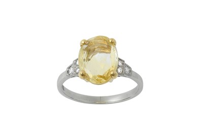 Lot 2243 - A Platinum Yellow Sapphire and Diamond Ring...