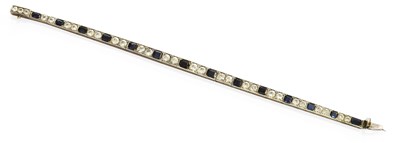 Lot 349 - A Synthetic Sapphire and Colourless Stone...