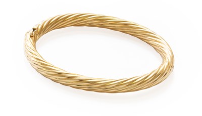 Lot 117 - A Hinged Bangle, of twisted form, inner...