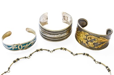 Lot 125 - Three Bangles, of varying design and size,...