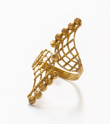 Lot 75 - A Crossover Ring, of textured bead design,...