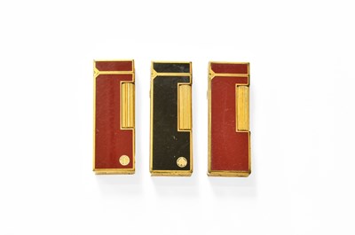 Lot 18 - Three Dunhill "Rollagas" Lighters, with enamel...
