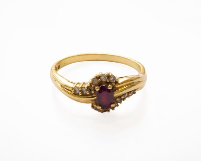 Lot 164 - A Sapphire and Diamond Cluster Ring, stamped...