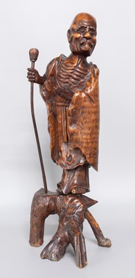 Lot 234 - A Chinese Carved Rootwood Figure of a Nomad,...