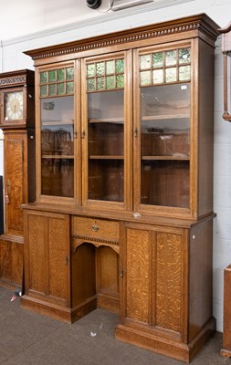 Lot 1210 - An Arts & Crafts Oak Bookcase Cabinet, the...