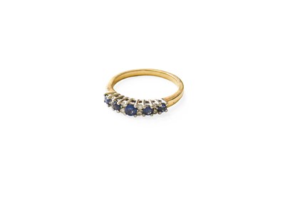 Lot 79 - A 9 Carat Gold Sapphire and Diamond Ring, five...