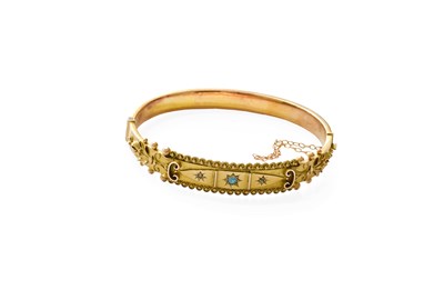 Lot 66 - A 9 Carat Opal and Diamond Bangle, the front...