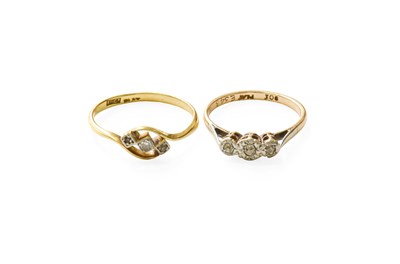 Lot 57 - A Diamond Three StoneTwist Ring, stamped '18CT'...