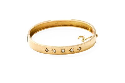 Lot 133 - A Diamond Bangle, the front inset with five...