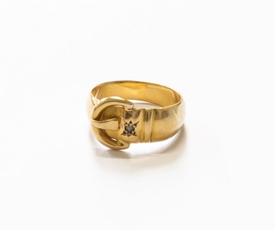 Lot 61 - An 18 Carat Gold Diamond Buckle Ring, finger...