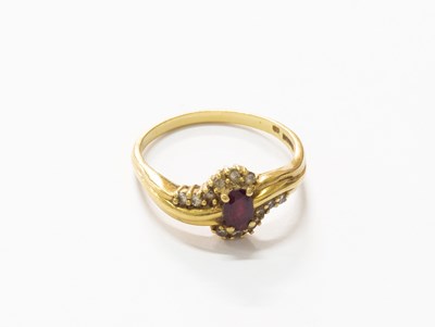Lot 169 - An 18 Carat Gold Ruby and Diamond Ring, the...