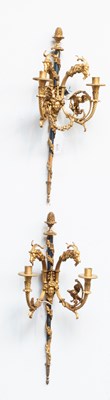 Lot 1276 - A Pair of Parcel Gilt Metal Twin-Light Wall...