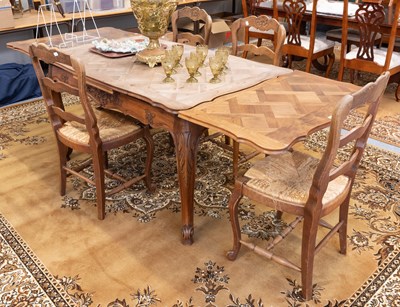 Lot 1391 - A French Draw Leaf Oak Dining Table; together...