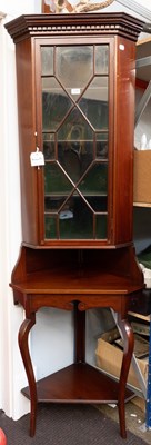 Lot 1220 - A Mahogany Free Standing Corner Cupboard, the...