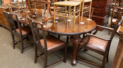 Lot 1281 - An Early 20th Century Mahogany Wind-Out Table...