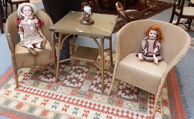 Lot 1338 - Lloyd Loom "Lusty" Two-Tier Gilt Painted Table,...