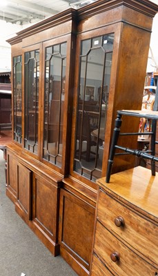 Lot 1238 - A George III Style Walnut Breakfront Bookcase...