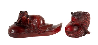 Lot 12 - A Japanese Pressed Amber Netsuke, 20th century,...