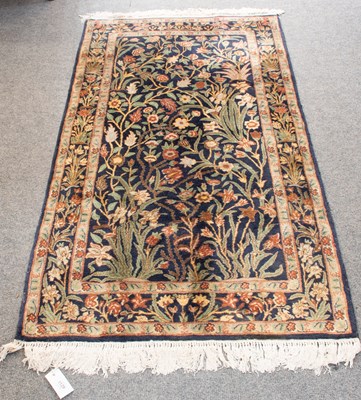 Lot 1129 - Ghom Rug, the deep indigo field of meandering...