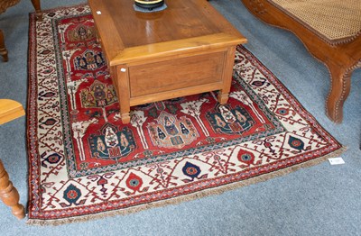 Lot 1128 - Caucasian Design Rug, the brick red field...