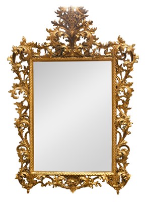 Lot 1141 - A Florentine-Style Carved Giltwood Wall Mirror,...