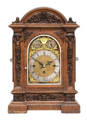 Lot 261 - A Carved Oak Chiming Table Clock, retailed by...
