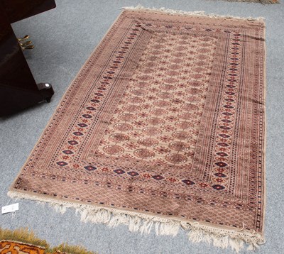 Lot 1134 - Afghan Gold Rug, the field with three elephant...