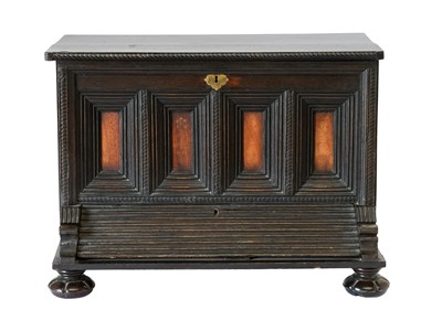 Lot 446 - An Oak Chest, of unusual form, the hinged lid...