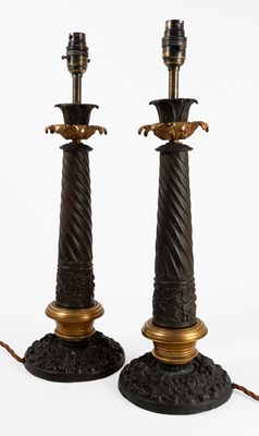Lot 169 - A Pair of Patinated and Parcel Gilt Metal...