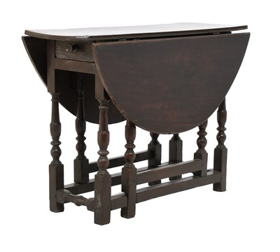 Lot 428 - A Queen Anne Oak Four-Seater Gateleg Dining...