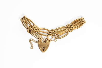 Lot 166 - A Gate Link Bracelet, stamped '375', with a 9...