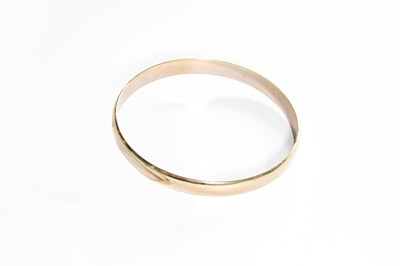 Lot 165 - A White Bangle, stamped '750', inner diameter...