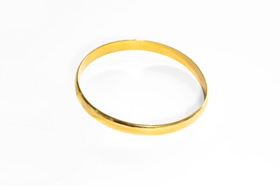Lot 169 - A Yellow Bangle, stamped '750', inner diameter...