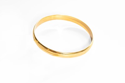 Lot 164 - A Yellow Bangle, stamped '750', inner diameter...