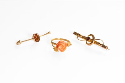 Lot 170 - A Carved Coral Ring, of foliate design, finger...