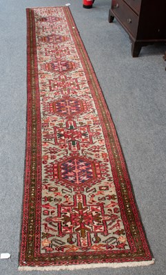 Lot 1142 - Narrow Karaja runner, the ice blue field with...