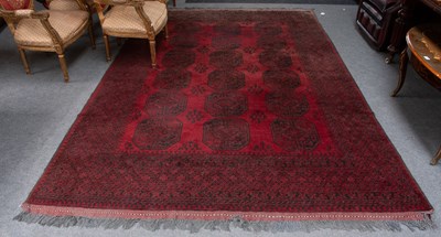 Lot 1145 - Afghan Turkmen Carpet, the crimson field with...