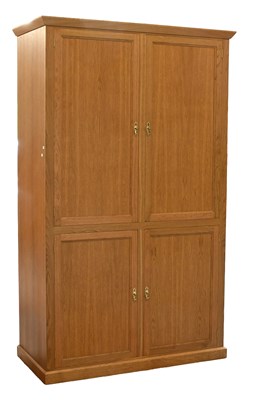 Lot 1395 - A Modern Oak Veneered Four Door Office...