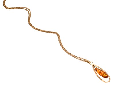 Lot 228 - An Amber Pendant on Chain, the pear shaped...